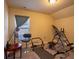 Home gym with adjustable inversion table, padded mats and natural light from the window at 8664 Spivey Village Trl, Jonesboro, GA 30236