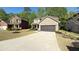 Well maintained home with attached garage and green lawn at 8664 Spivey Village Trl, Jonesboro, GA 30236