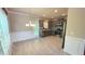 Open concept kitchen with stainless steel appliances and gray cabinetry at 8664 Spivey Village Trl, Jonesboro, GA 30236