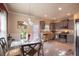 Eat-in kitchen featuring stainless steel appliances, gray cabinets, granite countertops, and tile backsplash at 8664 Spivey Village Trl, Jonesboro, GA 30236