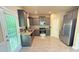 Well-lit kitchen with stainless steel appliances and modern gray cabinets at 8664 Spivey Village Trl, Jonesboro, GA 30236