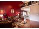 Spacious living room with hardwood floors, high ceilings, comfortable seating, and natural light at 8664 Spivey Village Trl, Jonesboro, GA 30236