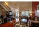 Bright living room featuring hardwood floors, high ceilings, comfortable seating, and ample natural light at 8664 Spivey Village Trl, Jonesboro, GA 30236