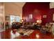 Bright living room featuring hardwood floors, high ceilings, comfortable seating, and ample natural light at 8664 Spivey Village Trl, Jonesboro, GA 30236