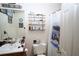 Simple bathroom with shelving, framed mirror, and shower-tub combination at 24 Lady Savannah Dr, Dallas, GA 30157