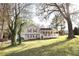Charming home with a covered porch, red shutters, gray siding, and a detached two-car garage at 24 Lady Savannah Dr, Dallas, GA 30157
