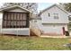 Back of house featuring a screened porch and second story entrance at 24 Lady Savannah Dr, Dallas, GA 30157