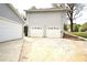 Detached garage with ample parking, multiple doors, and extra storage at 24 Lady Savannah Dr, Dallas, GA 30157