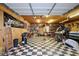 Spacious garage with checkered floors and extensive storage solutions at 24 Lady Savannah Dr, Dallas, GA 30157
