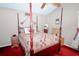 Elegant bedroom with four-poster bed, decorative pillows, and coordinated furnishings at 24 Lady Savannah Dr, Dallas, GA 30157