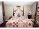 Elegant bedroom with four-poster bed, decorative pillows, and coordinated furnishings at 24 Lady Savannah Dr, Dallas, GA 30157