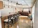 Spacious basement with a bar area and adjacent theater room with plush seating at 311 Carmichael Cir, Canton, GA 30115