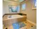Relaxing bathroom featuring soaking tub with tile surround at 311 Carmichael Cir, Canton, GA 30115