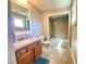Modern bathroom with a large mirror, sink, and tiled shower at 311 Carmichael Cir, Canton, GA 30115