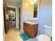 Bathroom with a vanity with a mirror and a doorway view to a bonus room at 311 Carmichael Cir, Canton, GA 30115