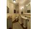 Elegant powder room features pedestal sink, wainscoting, and stylish fixtures at 311 Carmichael Cir, Canton, GA 30115