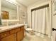 Bathroom featuring a framed mirror and shower with curtain at 311 Carmichael Cir, Canton, GA 30115