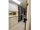 Walk-in closet with custom shelving and hanging storage at 311 Carmichael Cir, Canton, GA 30115