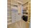 Walk-in closet with custom white shelves and drawers for organization at 311 Carmichael Cir, Canton, GA 30115