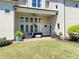 Charming covered patio with comfortable seating and a ceiling fan, perfect for outdoor relaxation at 311 Carmichael Cir, Canton, GA 30115