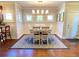 Charming dining room featuring hardwood floors and a stylish chandelier at 311 Carmichael Cir, Canton, GA 30115