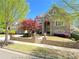 Attractive brick home with front porch, colorful landscaping, and inviting curb appeal at 311 Carmichael Cir, Canton, GA 30115