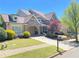 Charming brick home featuring a portico, lush landscaping, and a welcoming front yard at 311 Carmichael Cir, Canton, GA 30115