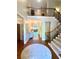 Elegant foyer with hardwood floors, staircase, and view into the living area at 311 Carmichael Cir, Canton, GA 30115