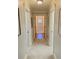 Hallway with carpeted floors, neutral walls, and views into adjacent rooms at 311 Carmichael Cir, Canton, GA 30115