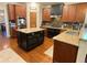 Well-appointed kitchen with granite countertops, hardwood floors, and ample cabinet space at 311 Carmichael Cir, Canton, GA 30115