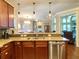 Kitchen boasting pendant lighting, stainless steel appliances, and granite countertops at 311 Carmichael Cir, Canton, GA 30115