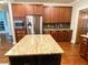 Well-equipped kitchen featuring granite countertops and stainless steel appliances at 311 Carmichael Cir, Canton, GA 30115
