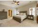 Inviting main bedroom with neutral tones, a ceiling fan, and natural light at 311 Carmichael Cir, Canton, GA 30115