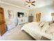 Serene main bedroom features a ceiling fan and ample natural light at 311 Carmichael Cir, Canton, GA 30115