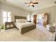Spacious main bedroom with seating and double doors to an adjacent room at 311 Carmichael Cir, Canton, GA 30115