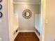 Mudroom with bench seating, storage cubbies, and a decorative mirror at 311 Carmichael Cir, Canton, GA 30115