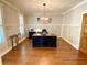 Spacious office features hardwood floors, wainscoting, and an attractive modern chandelier at 311 Carmichael Cir, Canton, GA 30115