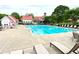 Beautiful pool area with lounge chairs, splash pad, and access to other community amenities at 311 Carmichael Cir, Canton, GA 30115