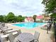 Resort-style pool with ample seating and pristine landscaping provides a relaxing outdoor oasis at 311 Carmichael Cir, Canton, GA 30115