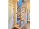 Hardwood staircase with iron balusters and a view to the upper level at 311 Carmichael Cir, Canton, GA 30115