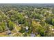 An aerial view shows the property and its surrounding lush green neighborhood at 4425 Reef Rd, Marietta, GA 30066