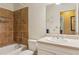 This bathroom features a single sink vanity and a shower over tub with a tiled wall at 4425 Reef Rd, Marietta, GA 30066