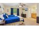 A bright bedroom featuring two twin beds, a ceiling fan, and a view of the backyard at 4425 Reef Rd, Marietta, GA 30066