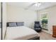 This bedroom features a comfy chair, a queen-sized bed, and a window for natural light at 4425 Reef Rd, Marietta, GA 30066
