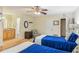 A bright bedroom with two beds, ceiling fan, and direct access to a bathroom at 4425 Reef Rd, Marietta, GA 30066