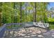 Spacious deck surrounded by lush trees, offering a tranquil spot to enjoy the outdoors and scenic views at 4425 Reef Rd, Marietta, GA 30066