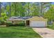 Charming ranch home with a one-car garage, stone accents, and a well-manicured lawn at 4425 Reef Rd, Marietta, GA 30066
