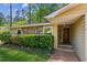 Inviting front exterior with stone accents, manicured bushes, and a stylish front door at 4425 Reef Rd, Marietta, GA 30066