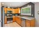 A well-maintained kitchen featuring stainless steel appliances and generous counter space for cooking and preparing meals at 4425 Reef Rd, Marietta, GA 30066
