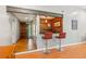 Living room view towards entryway with bar and hardwood floors at 4425 Reef Rd, Marietta, GA 30066